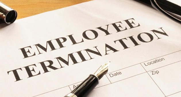 Employment termination form with a pen on it